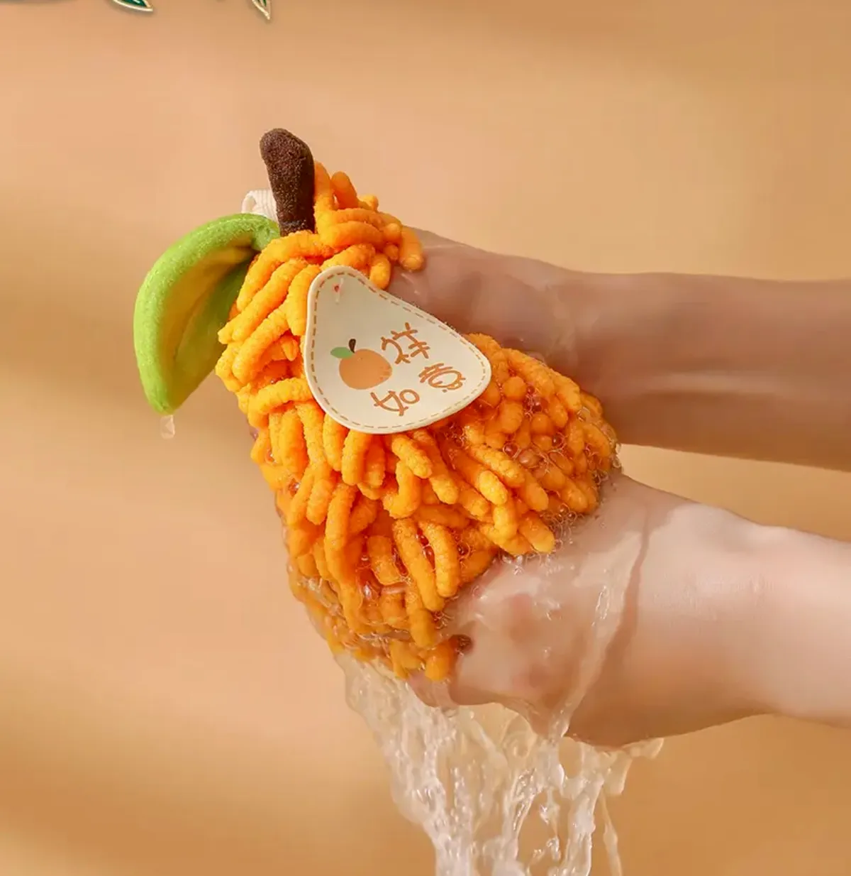 A fruit-patterned chenille hand towel